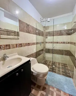 a bathroom with a toilet and a sink and a shower at Apartamento Luz De Luna in Jardin