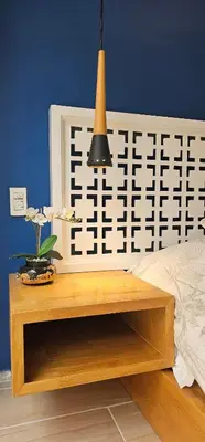 a bedroom with a bed and a wooden table at Homely Penthouse in Provenza in Medellín