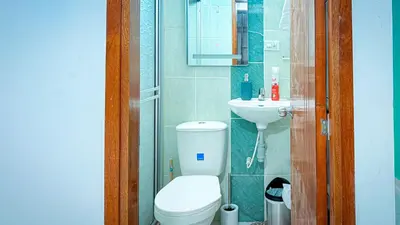 a small bathroom with a toilet and a sink at Laureles Coliving House Medellín in Medellín