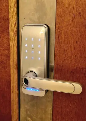 a close up of a door handle on a wooden door at Exclusive penthouse in Provenza in Medellín