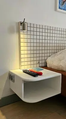 a white table with two remote controls on it at Exclusive penthouse in Provenza in Medellín