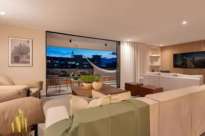 a living room with a couch and a table at Tivoli 202 - Escapada Premium con Jacuzzi Privado in Medellín