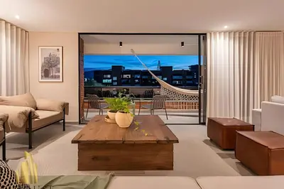 a living room with a couch and a coffee table at Tivoli 202 - Escapada Premium con Jacuzzi Privado in Medellín