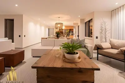 a living room with a couch and a table at Tivoli 202 - Escapada Premium con Jacuzzi Privado in Medellín