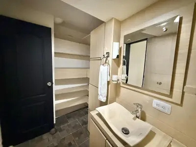 a bathroom with a sink and a mirror at Medellín Poblado Gem Steps to Cafés & Nightlife in Medellín