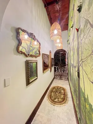a room with a chair and a painting on the wall at Casablanca Hotel Boutique Salamina in Salamina