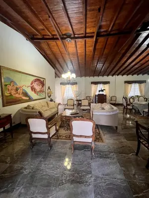 a large living room with chairs and a couch at Casablanca Hotel Boutique Salamina in Salamina