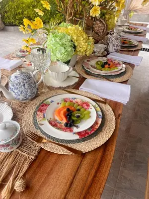 a wooden table with plates of food on it at Casablanca Hotel Boutique Salamina in Salamina