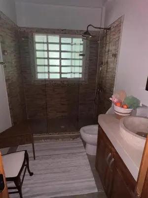 a bathroom with a shower and a toilet and a sink at Casablanca Hotel Boutique Salamina in Salamina