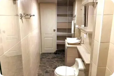 a bathroom with a toilet and a shower and a sink at Group Stay in Poblado - Walk Everywhere - King Bed in Medellín