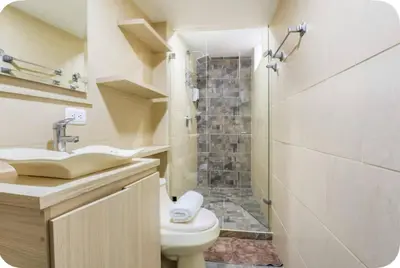 a bathroom with a sink and a toilet and a shower at Group Stay in Poblado - Walk Everywhere - King Bed in Medellín