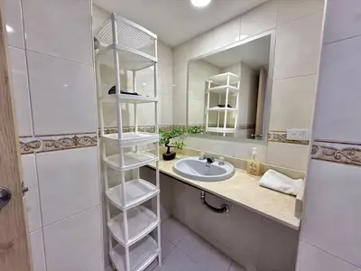 a bathroom with a sink and a mirror at Medellin Poblado Gem Walk to Provenza and Lleras in Medellín