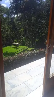 an open door to a park with a picnic table at Cabaña campestre in Medellín