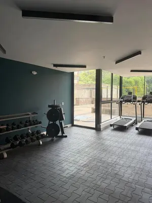a gym with a bunch of equipment in a room at Poblado de lujo in Medellín