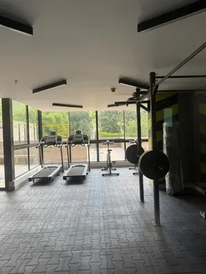 a gym with several cardio machines in a room at Poblado de lujo in Medellín