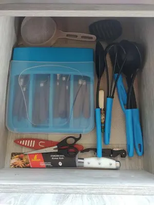 a drawer filled with kitchen utensils and a box at Country cabin with panoramic view among clouds - cabaña refugio entre nubes in Támesis