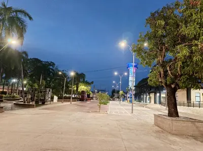 a street with many street lights and a tree at Alojamiento Sol Naciente in Puerto Triunfo
