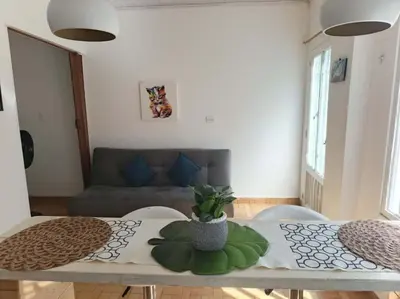 a living room with a table and a couch at Alojamiento Sol Naciente in Puerto Triunfo