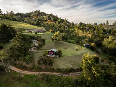 an aerial view of a house on a hill at Retreat Villas Llanogrande By CHX in Rionegro