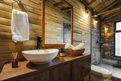 a bathroom with a sink and a toilet at Retreat Villas Llanogrande By CHX in Rionegro