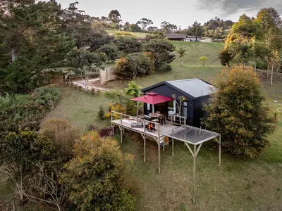 an overhead view of a tiny house in a field at Retreat Villas Llanogrande By CHX in Rionegro