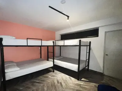 a room with two bunk beds in a room at Hotel Natural Medellin in Medellín