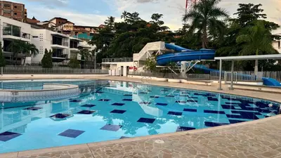 a large swimming pool with a water slide at Hermoso Apartasol, cerca al Parque Principal, Piscinas, Aire acondicionado in Santa Fe de Antioquia
