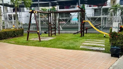 a park with a playground with a yellow slide at Hermoso Apartasol, cerca al Parque Principal, Piscinas, Aire acondicionado in Santa Fe de Antioquia