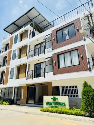 a building with a sign in front of it at View Theras Hotel in Doradal