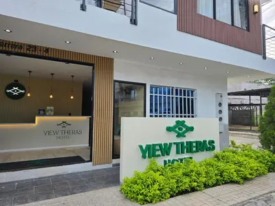 a view threes sign in front of a building at View Theras Hotel in Doradal