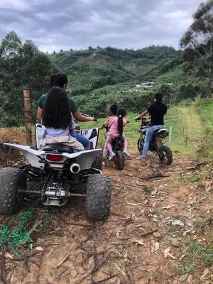 a group of people riding on a four wheeler at finca hotel ganbaru