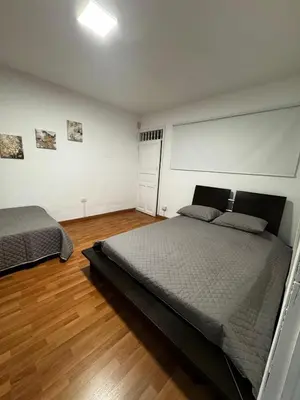 a bedroom with two beds in a room at Apartamento Rosa colonial in Medellín