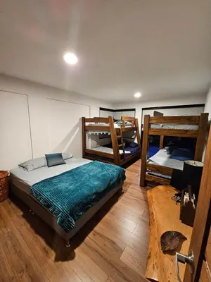 a room with three bunk beds in it at Finca de Lujo en Rionegro -30 min Airport -1 hr Guatapé in Rionegro