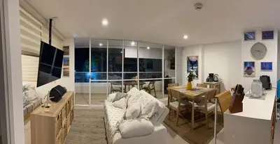 a living room with a couch and a table at Apartamento loft en Santa Fe de Antioquia in Santa Fe de Antioquia