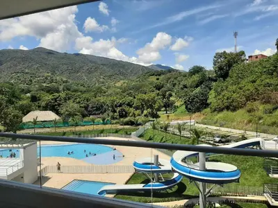 a view of a swimming pool from a balcony at Apartamento loft en Santa Fe de Antioquia in Santa Fe de Antioquia