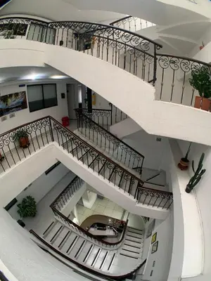an overhead view of a spiral staircase in a building at Hotel Santorini la 70 in Medellín