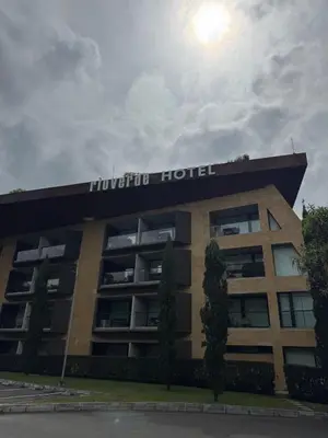 a building with a hotel sign on top of it at Hotel rioverde aparta suite cerca de aeropuerto JMC in José María Córdova International