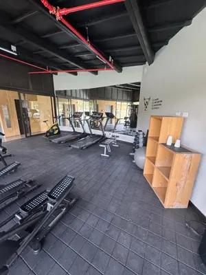 an empty gym with several treadmills and exercise machines at Hotel rioverde aparta suite cerca de aeropuerto JMC in José María Córdova International