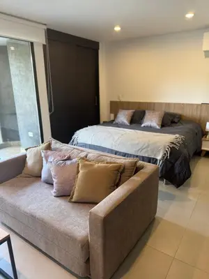 a living room with two beds and a couch at Hotel rioverde aparta suite cerca de aeropuerto JMC in José María Córdova International