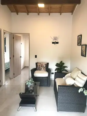 a living room with a couch and a table at Apartamento en Rionegro in Rionegro