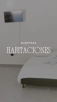 a bed in a room with a sign that reads nicabase habitats at JyM apartaestudios in Doradal