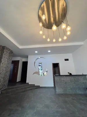 a large room with a large chandelier in the ceiling at SUITE DE LUJO FARO con Aire Acondicionado y Coworking in Medellín