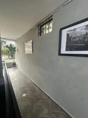 a hallway with a picture on a wall at Apartamentos Acogedores Laureles in Medellín
