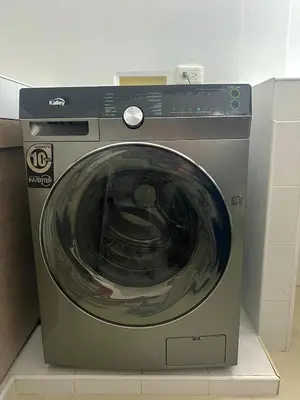 a washing machine sitting on top of a box at Comfortable and equipped apartment 5 minutes from the 70 Laureles in Medellín