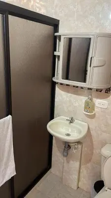 a bathroom with a sink and a mirror at Finca el Majagual in Guatapé