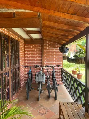 two bikes are parked on a porch at Finca el Majagual in Guatapé