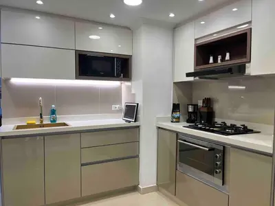 a kitchen with a sink and a stove top oven at Casa Amsterdam with Jacuzzi in Poblado Medellín in Medellín