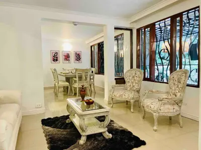 a living room with a couch and a table and chairs at Casa Amsterdam with Jacuzzi in Poblado Medellín in Medellín