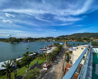 a view of a river with a town and a city at Hermoso Apartamento Frente al Embalse 2 Habs View in Guatapé