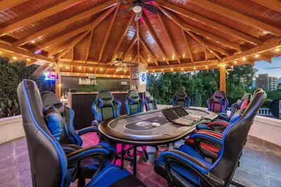 a group of chairs around a table in a room at Pool, Views, Sauna, Bar, Fire Pit and 24 HR Security in Medellín